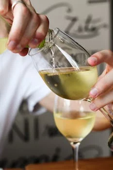 sommelier selecting wine pairing restaurant